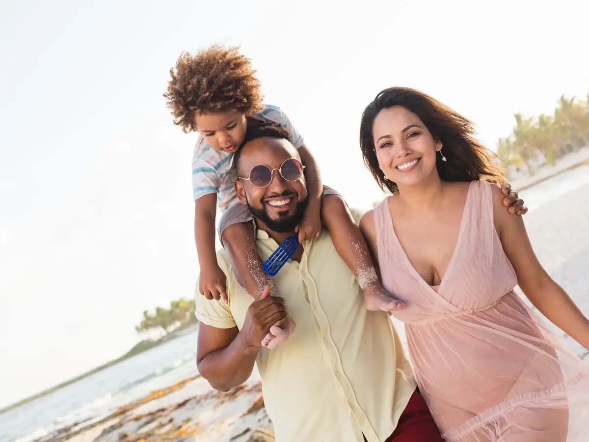 happy-ethnic-family-walking-together-on-beach-2025-04-04-21-45-28-utc_1200x900